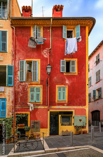 Colorful houses on a street in the Old Town, Vieille Ville in Nice, France