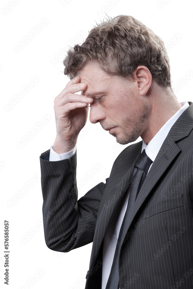 Stressed businessman having a bad headache Stressed businessman having a bad headache