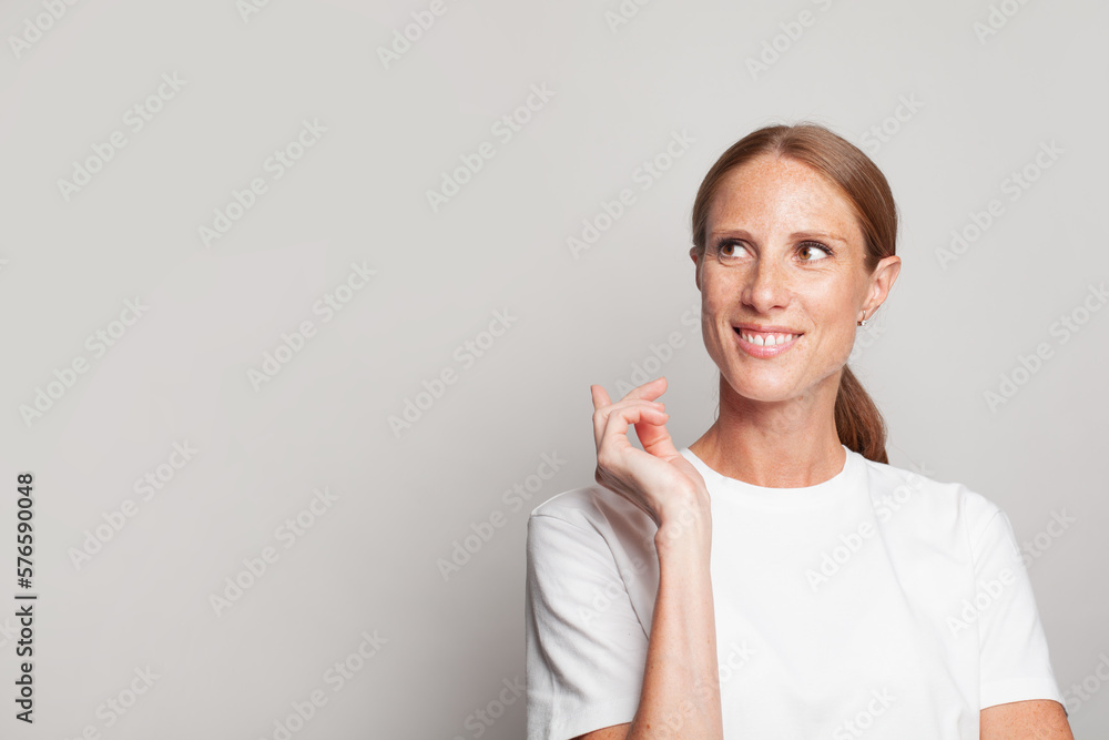 Portrait of smiling mature woman looking aside on white banner background Portrait of smiling mature woman looking aside on white banner background