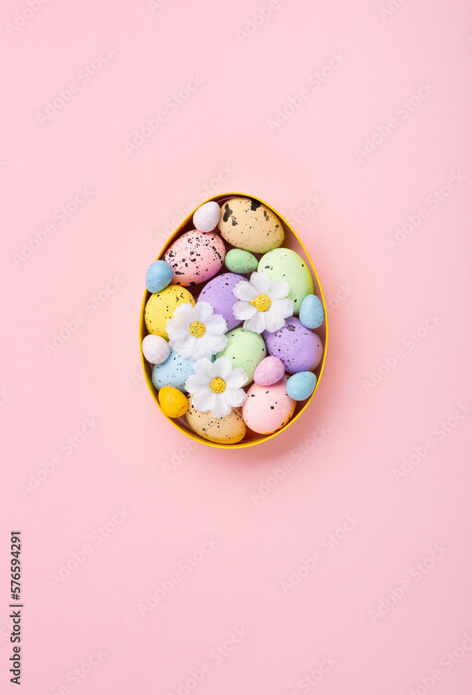 Easter Eggs with Sweets and Spring Flowers on Pink Background Easter Eggs with Sweets and Spring Flowers on Pink Background