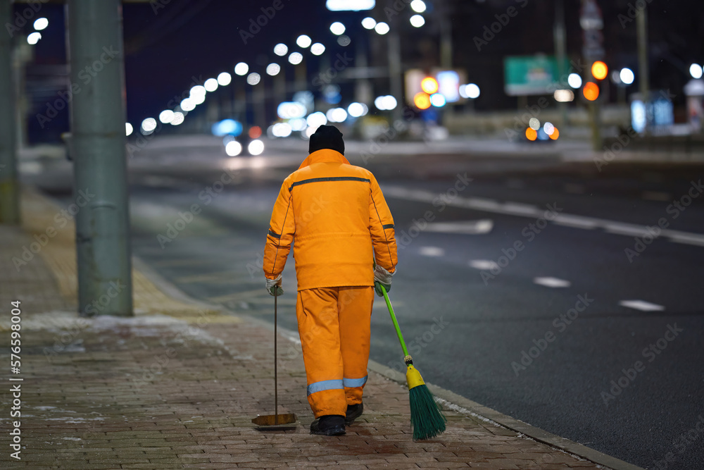 Worker sweep city street with broom and dustpan, janitor with