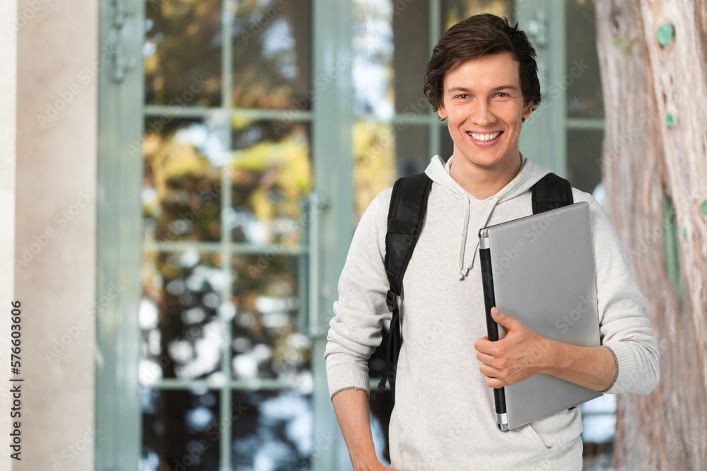 Fototapeta premium University young happy student posing in campus