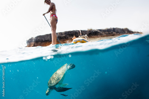 Pro SUP athlete Iballa Ruano paddles with the turtles photo