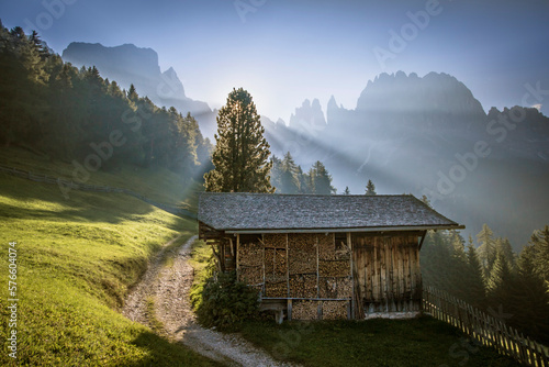 Sunrise Over A Mountain Meadow And Hut In The Dolomites photo