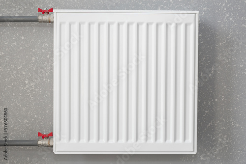 Wallpaper Mural White battery on the wall. Iron radiator. Modern heating system. Torontodigital.ca