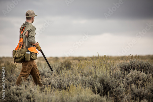 Man upland bird hunting with his dogs in the plains of northeastern Montana. photo