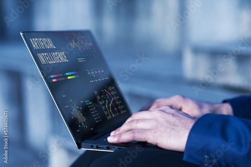 Man using AI (artificial intelligence) on a laptop, Artificial Intelligence. man using technology smart robot AI, artificial intelligence by enter command prompt for generates something Futuristic.