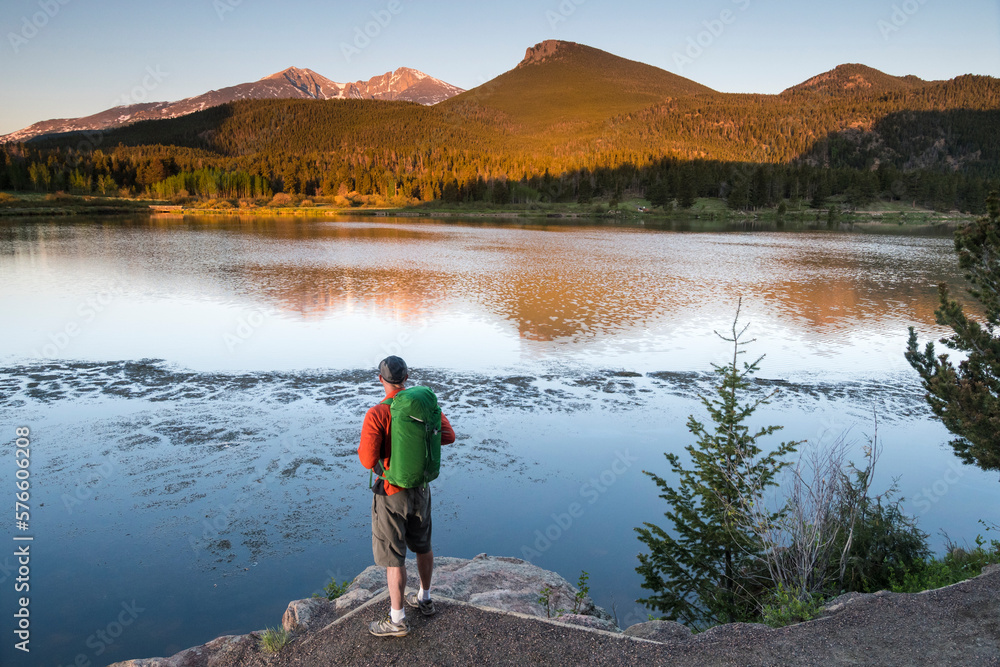 Man hiking along Lily Lake Trail, Rocky Mountain National Park, Estes Park, Colorado, USA Man hiking along Lily Lake Trail, Rocky Mountain National Park, Estes Park, Colorado, USA