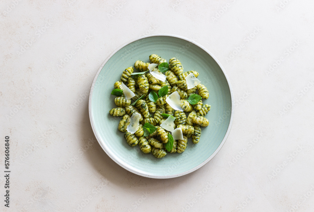 Gnocchi with pesto sauce, basil and Parmesan cheese. Healthy food. Vegetarian food. Diet. Gnocchi with pesto sauce, basil and Parmesan cheese. Healthy food. Vegetarian food. Diet.