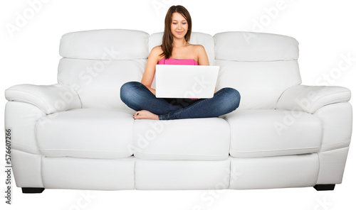 Portrait of a Young Woman Using her Laptop While Sitting on a Couch