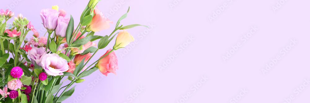 Top view image of pink and purple flowers composition over pastel background
