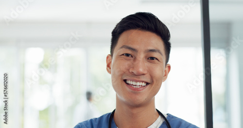 Asian man, face and doctor smile for healthcare, vision or career ambition and advice at the hospital. Portrait of happy and confident Japanese medical expert smiling, phd or medicare at the clinic