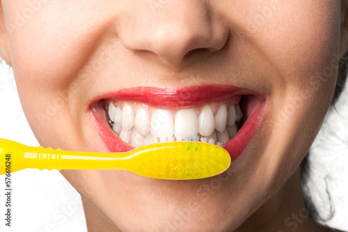 Closeup on a Woman Brushing her Teeth