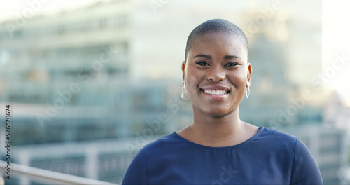 Face, business woman and designer in city with vision, idea and motivation for startup company on building background. Portrait, black woman and entrepreneur happy about black business goal in London
