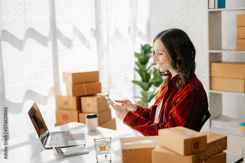 Small business entrepreneur SME freelance woman working at office, BOX,tablet and laptop online, marketing, packaging, delivery, e-commerce concept..