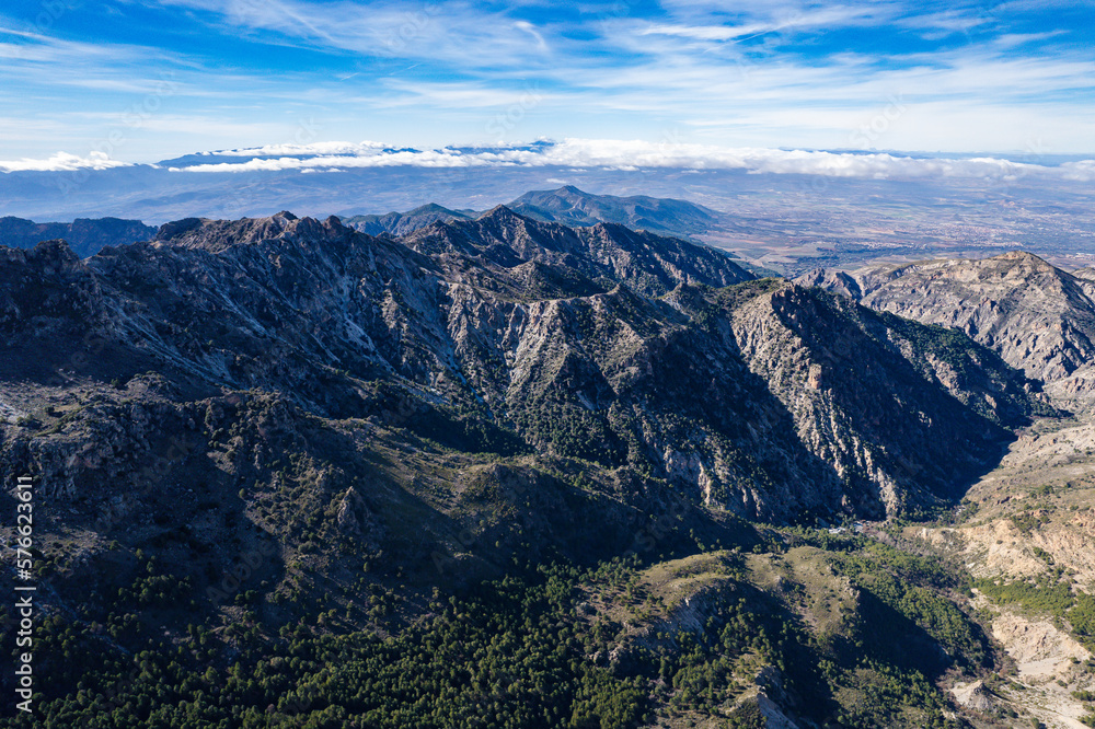 Aerial panoramic view of the mountains and valleys in the Sierra Nevada mountains in Spain