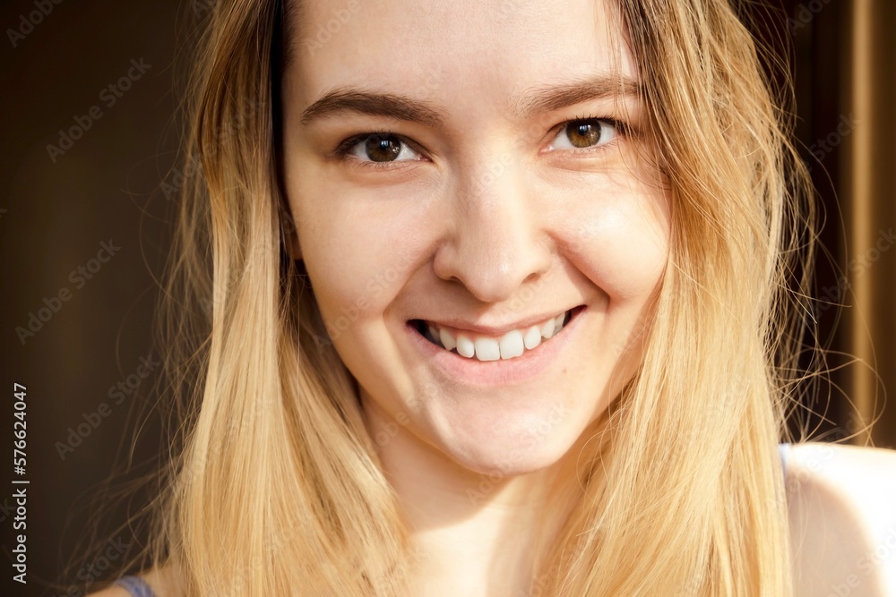 portrait of a blonde cheerful woman with white teeth and wide smile. no male up. natural beauty. attractive and happy face portrait of a blonde cheerful woman with white teeth and wide smile. no male up. natural beauty. attractive and happy face
