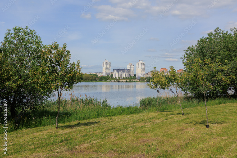 Buildings and houses standing on the shore of a lake, river or sea.
