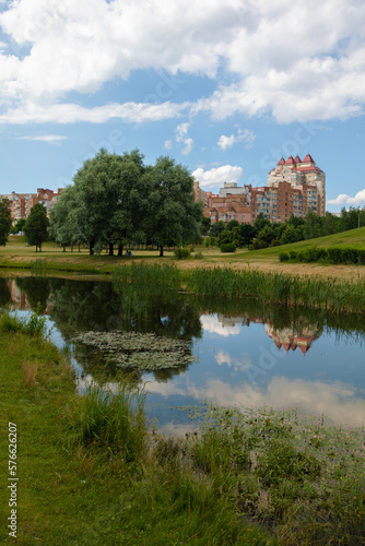 Buildings and houses standing on the shore of a lake, river or sea. 