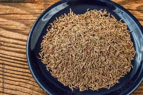 Aromatic roman cumin in a small bowl on the table