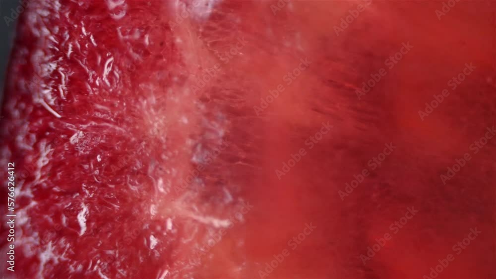 Red grapefruit parts. Close up view under the microscope. Red grapefruit parts. Close up view under the microscope.