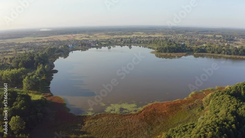 4k drone flight moving to the side footage (Ultra High Definition) of Pishchans'ke lake. Beautiful summer scene on Shatsky National Park, Volyn region, Ukraine, Europe. Traveling concept background.. photo