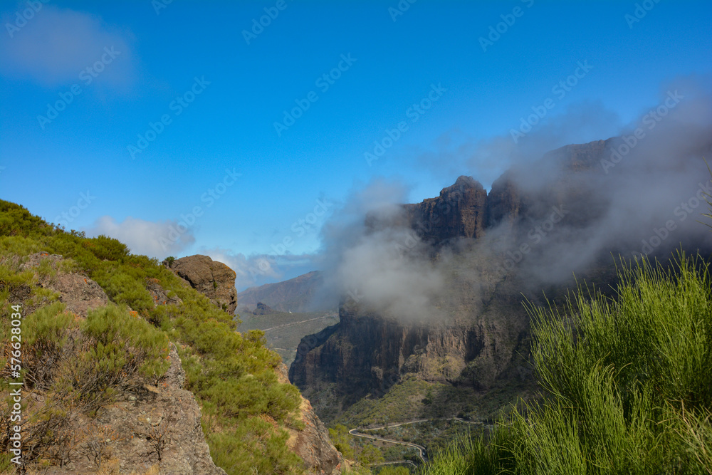 Low hanging clouds in the mountains with road on Tenerife in Spain