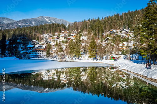 Winter reflections and fairytale houses in Kranjska Gora. Slovenia. photo