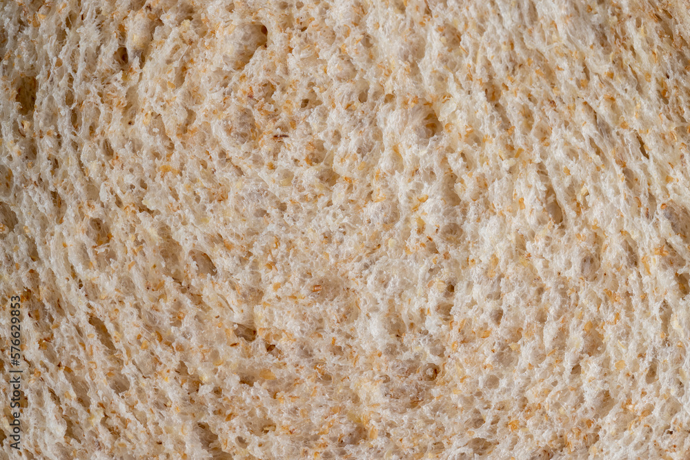Square loaf of light wheat bread cut into pieces Square loaf of light wheat bread cut into pieces