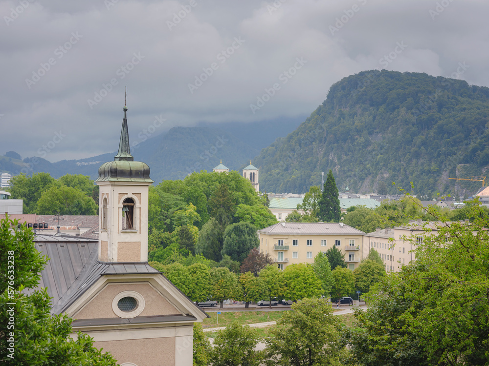 Historic city of Salzburg in summer, Austria. Leprosy house church and view on Salzburg
