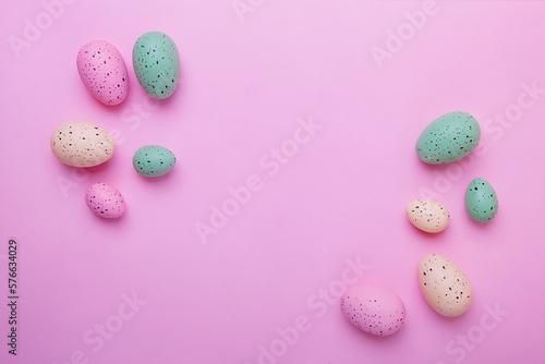 Frame from multicolored eggs on pink background,Easter concept.