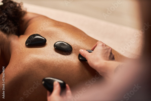 Relaxing hot stones massage that eases insomnia and promotes good sleep