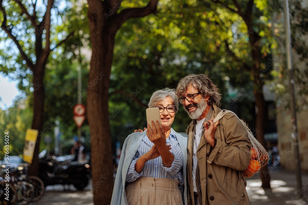 Senior couple taking selfie outside. Senior couple taking selfie outside.