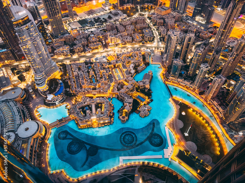 Slika na platnu Aerial view of Downtown Dubai with roads, Dubai Mall and the fountain at sunrise