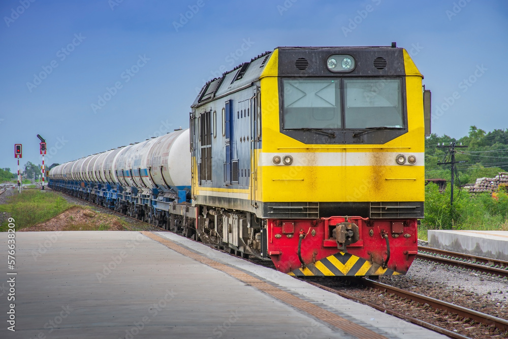 Tanker-freight train by diesel locomotive on the railway. Tanker-freight train by diesel locomotive on the railway.