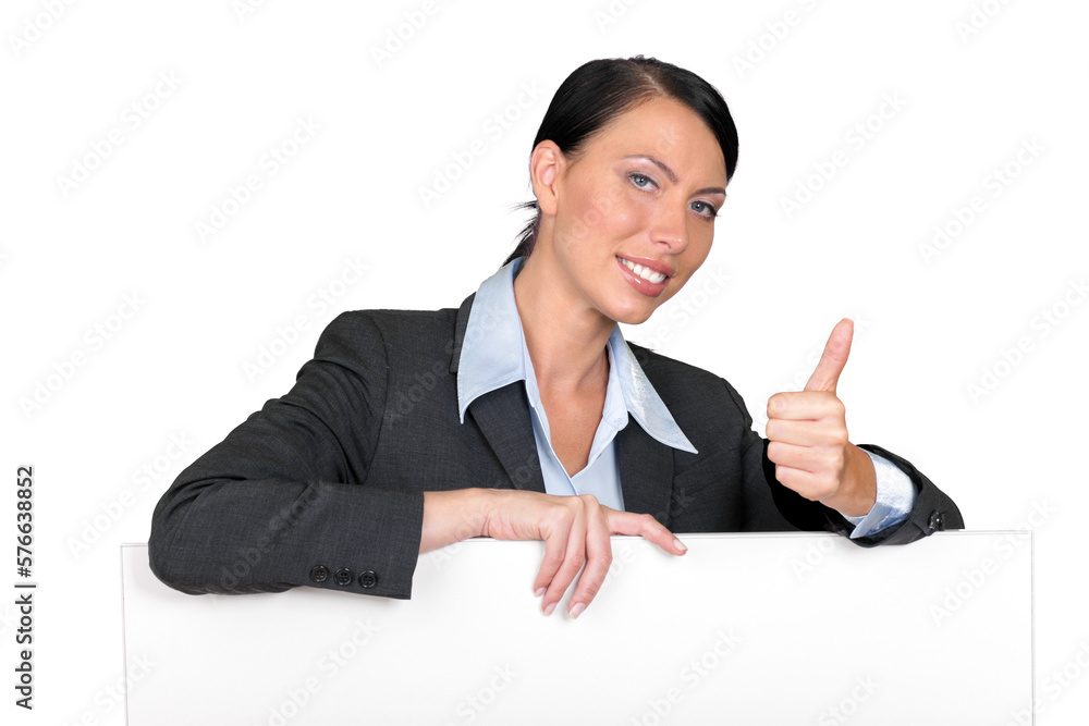 Beautiful businesswoman leaned on a blank billboard Beautiful businesswoman leaned on a blank billboard