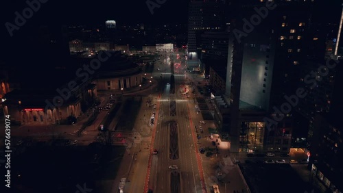 Wallpaper Mural Cars driving over the wide road between the high buildings at night. Drone dolley Torontodigital.ca