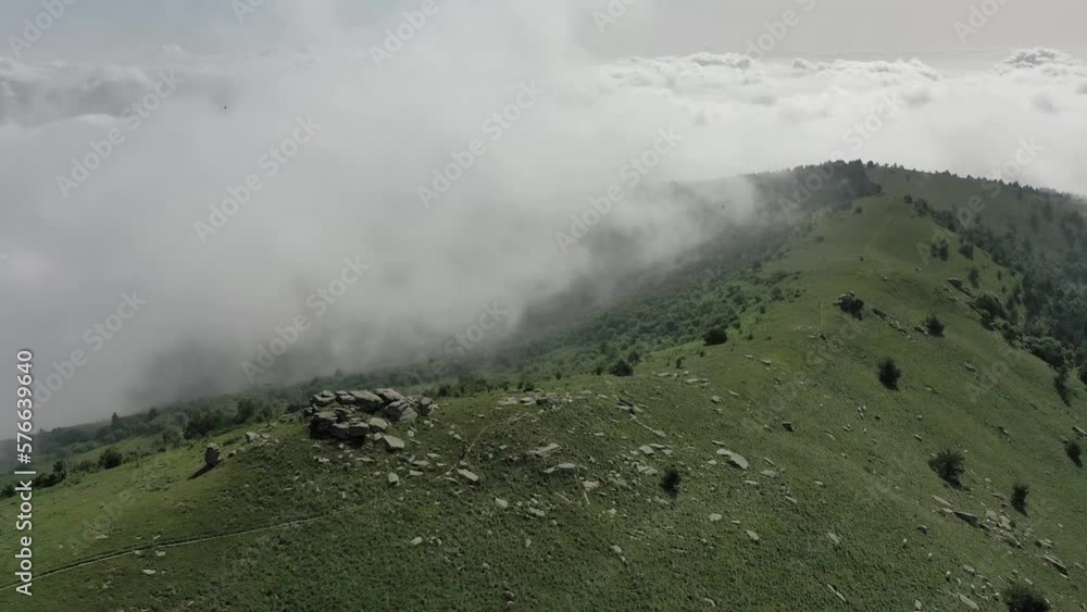 Aereal drone shot location mountain, sunny weather and movement from bottom to top. Clouds and clear sky. Aereal drone shot location mountain, sunny weather and movement from bottom to top. Clouds and clear sky.