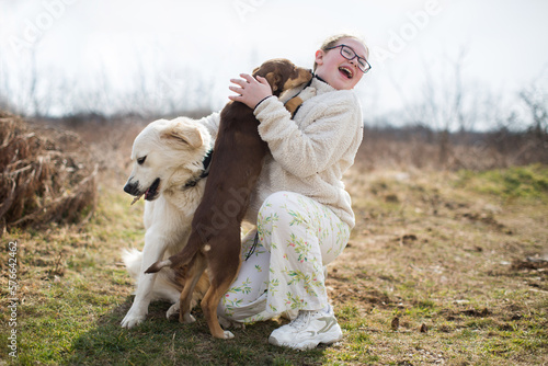 Friendly dog trying to lick the girl