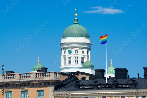 Rainbow flags and dome of Evangelical Lutheran Cathedral in Helsinki, Finland photo