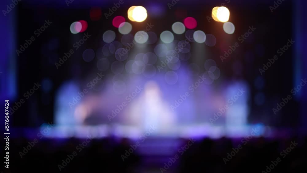 Blur defocus texture, background for design. Singers and musicians perform on scene. Blur defocus texture, background for design. Singers and musicians perform on scene.