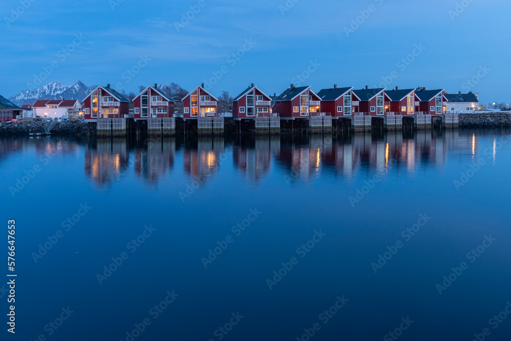 Fototapeta premium Lofoten islands in Norway landscape in winter Svolvaer harbor by sunset