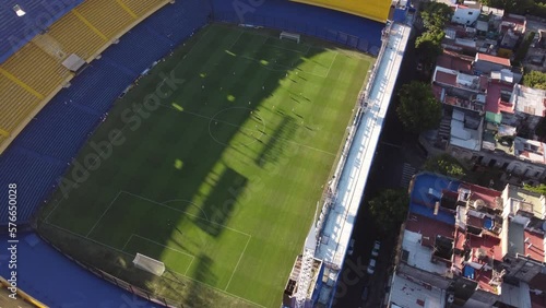 Professional soccer players training at Bombonera Stadium of Boca Juniors in Buenos Aires, Argentina. Aerial top-down view photo