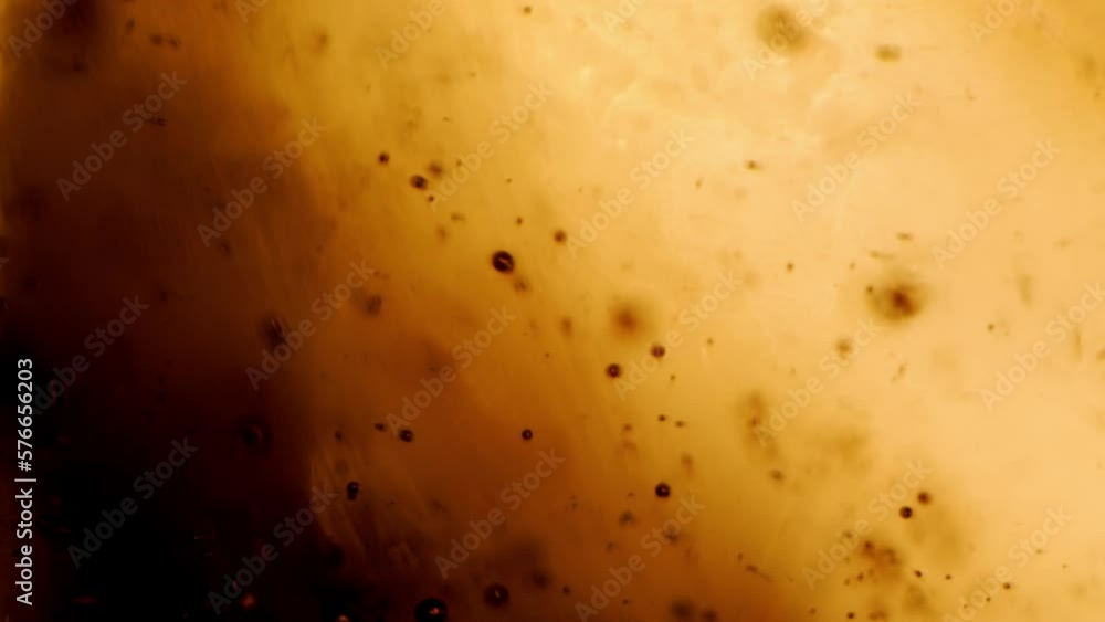 Amber texture, macro shots of oil or honey with bubbles Amber texture, macro shots of oil or honey with bubbles