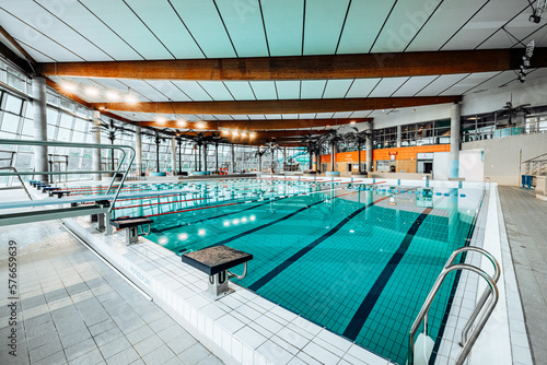 Swimming-Pool with equipment and large windows with a view outside