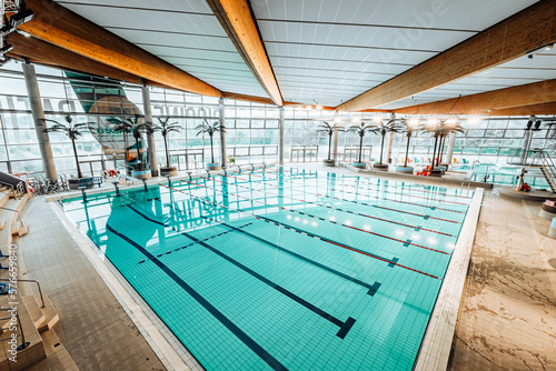 Swimming-Pool with equipment and large windows with a view outside