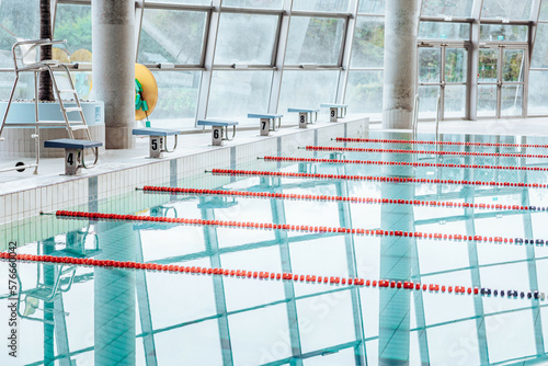 Swimming-Pool with equipment and large windows with a view outside