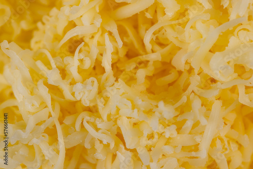 Hard cheese with holes grated into thin small slices