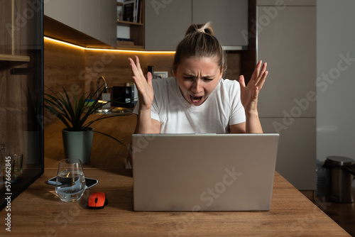 Young stressed hurt sad and shocked woman feeling betrayed finding out boyfriend husband is cheating on her by reading his messages and emails on laptop computer. Relationship marriage difficulties
