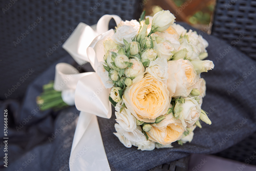 the bride's bouquet is on the groom's jacket at the wedding the bride's bouquet is on the groom's jacket at the wedding